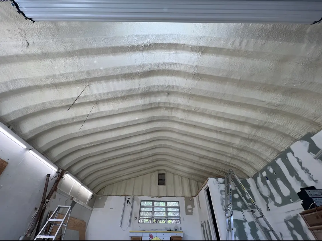 Spray polyurethane foam applied to the underside of a metal roof deck in North Stonington